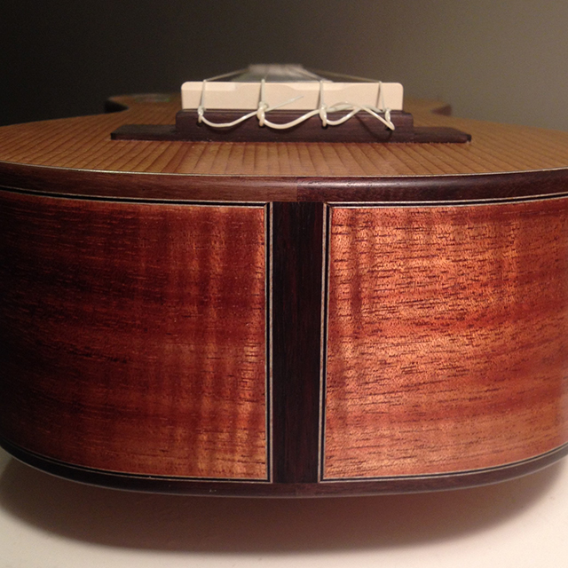 very close view of fine mitered tail block detail in koa and rosewood